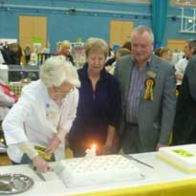 Mrs Bullock cutting the cake
